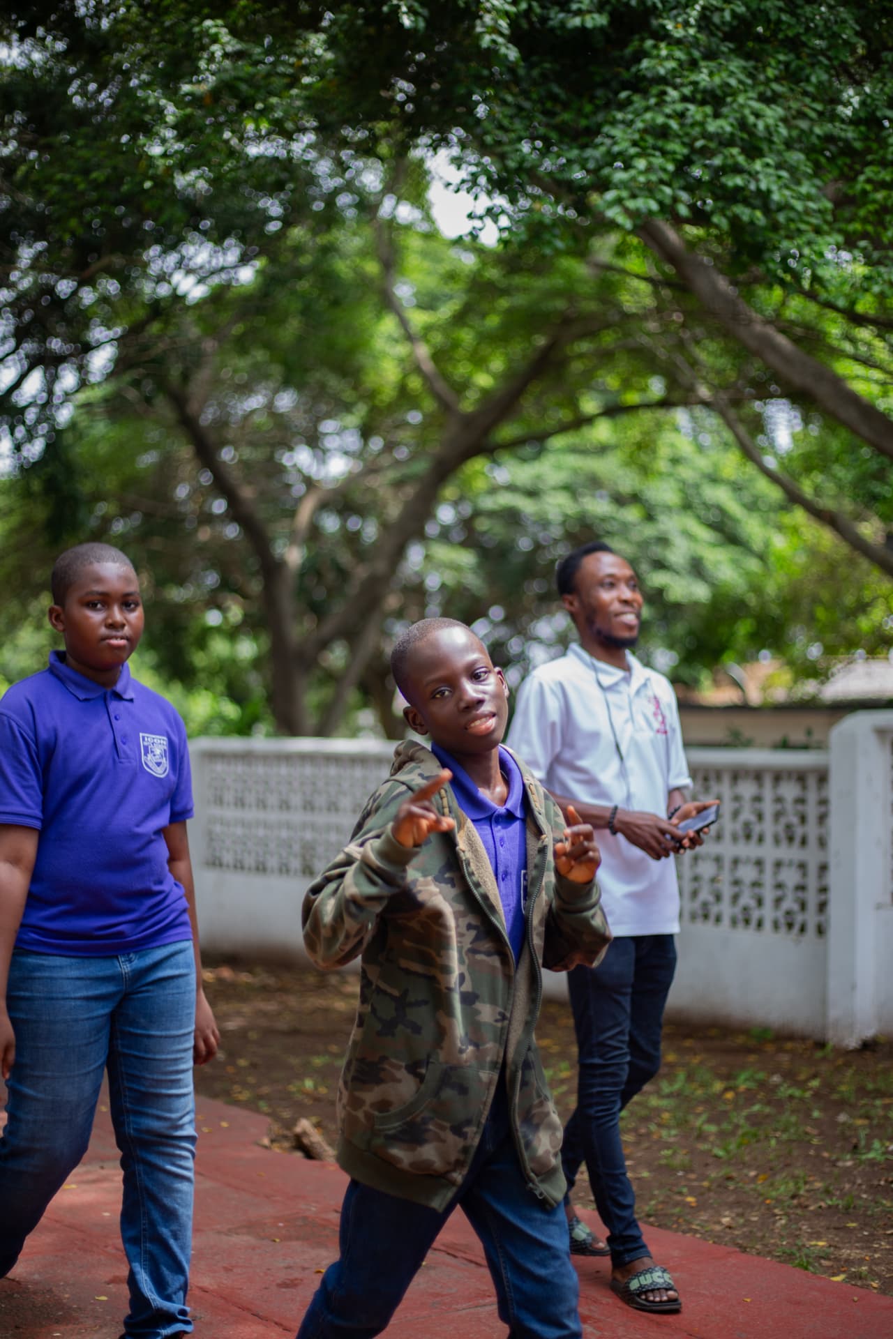 Icon learners walking to an inter-school event with a teacher